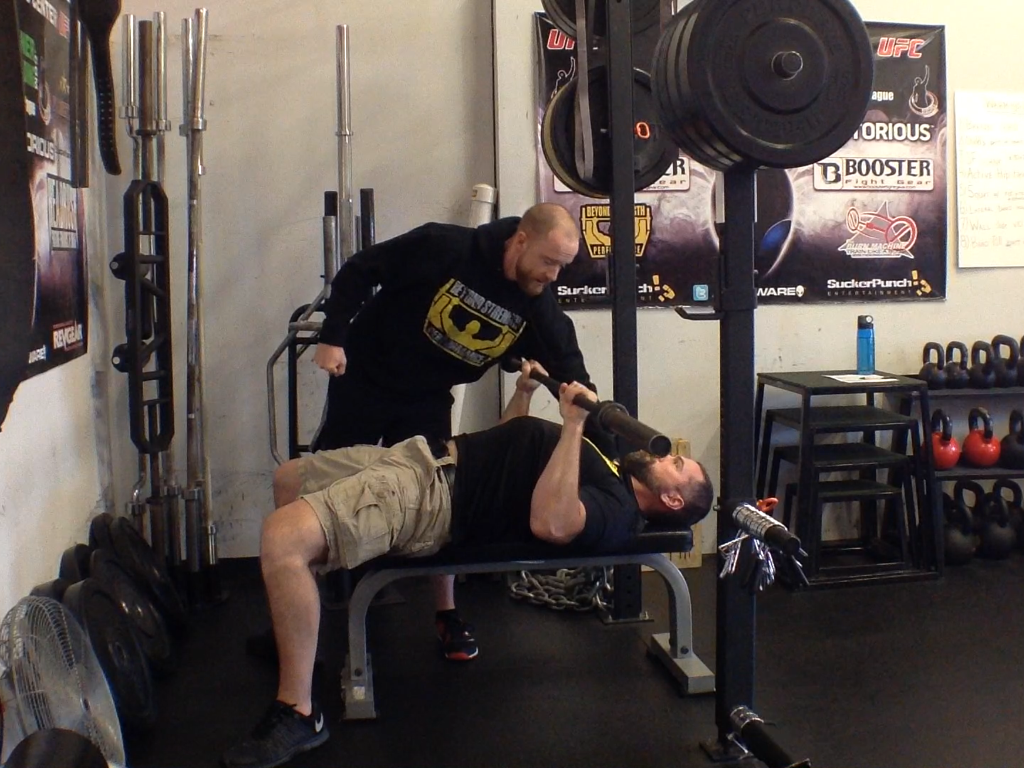 Pull (row) the bar to establish a good base to press from